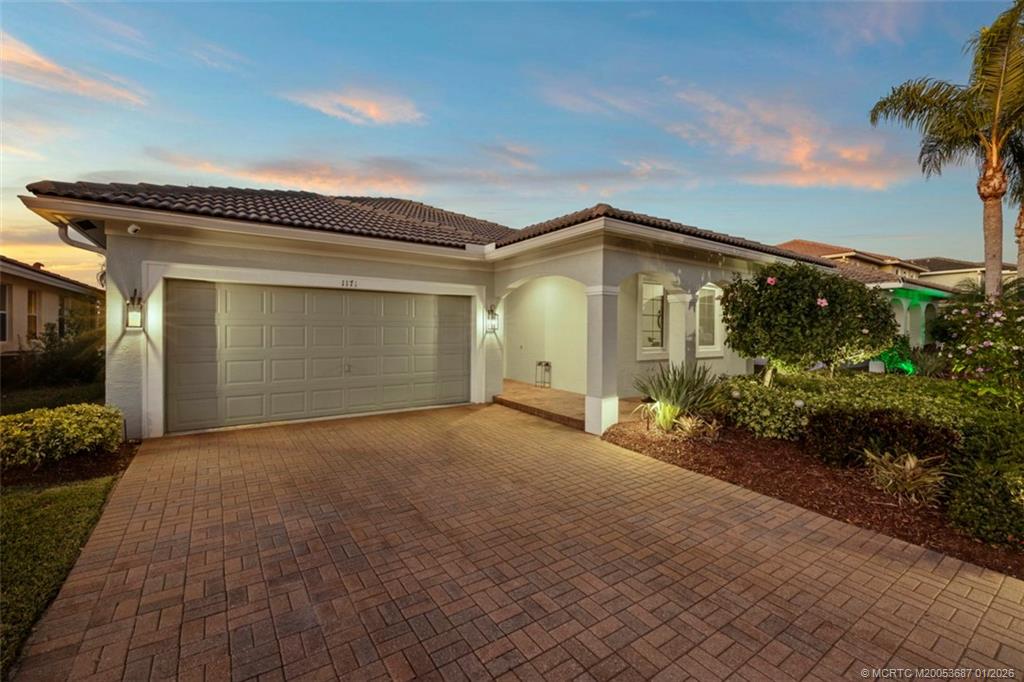 1171 Southeast Kirk Street Stuart, FL 34997 - Photo 6 of 47 a view of a house with a yard