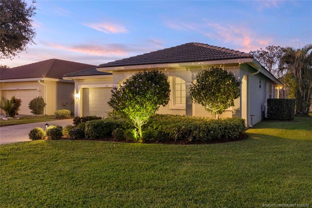 1171 Southeast Kirk Street Stuart, FL 34997 - Photo 7 of 47 a view of a house with a garden