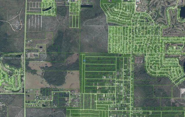 a bathroom with a glass door shower and a sink