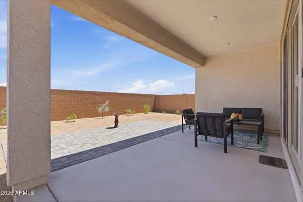 a view of chairs and table in patio