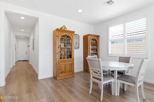 a view of a dining room with furniture and window