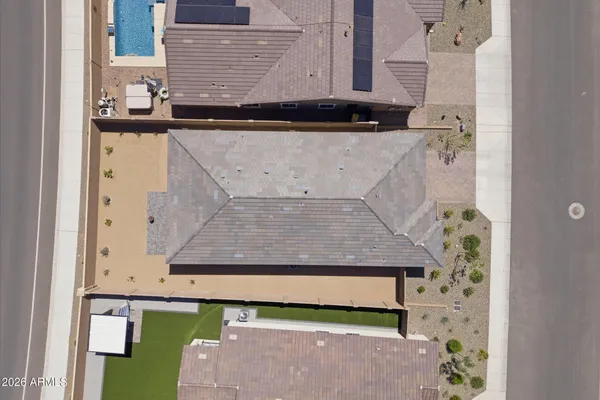 an aerial view of residential houses with wooden fencing