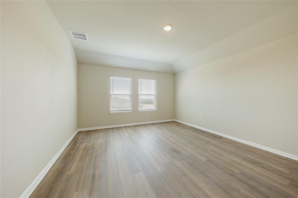 521 Otto Avenue Georgetown, TX 78626 - Photo 12 of 38 Unfurnished room with baseboards and light wood finished floors