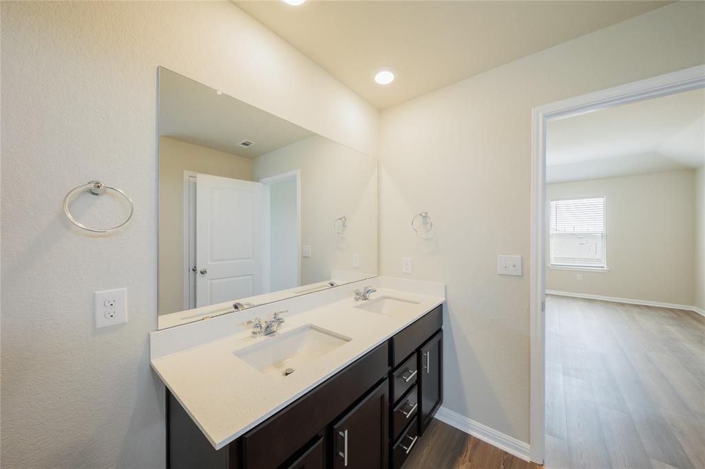 521 Otto Avenue Georgetown, TX 78626 - Photo 14 of 38 Full bath with double vanity, dark wood-style flooring, and recessed lighting