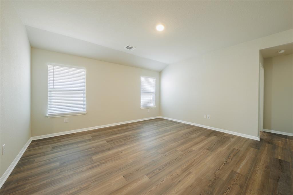 521 Otto Avenue Georgetown, TX 78626 - Photo 21 of 38 Unfurnished room with dark wood-style flooring, lofted ceiling, and recessed lighting