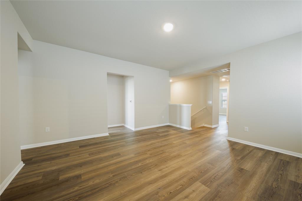 521 Otto Avenue Georgetown, TX 78626 - Photo 23 of 38 Unfurnished room with dark wood finished floors and recessed lighting