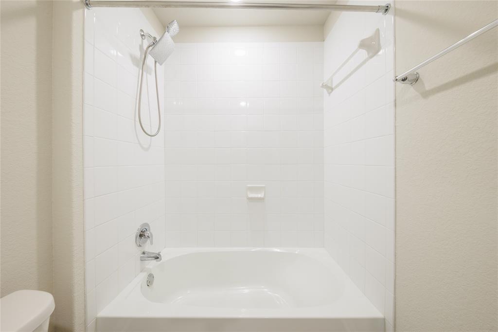 521 Otto Avenue Georgetown, TX 78626 - Photo 29 of 38 Bathroom with shower / bathtub combination and a textured wall