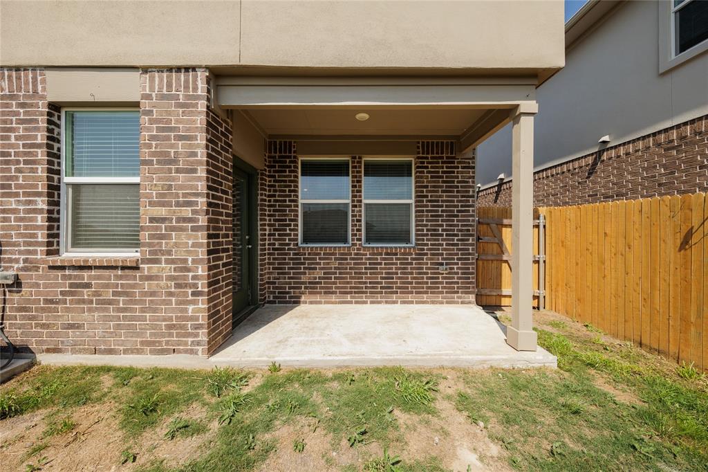 521 Otto Avenue Georgetown, TX 78626 - Photo 32 of 38 Property entrance featuring brick siding and a patio area