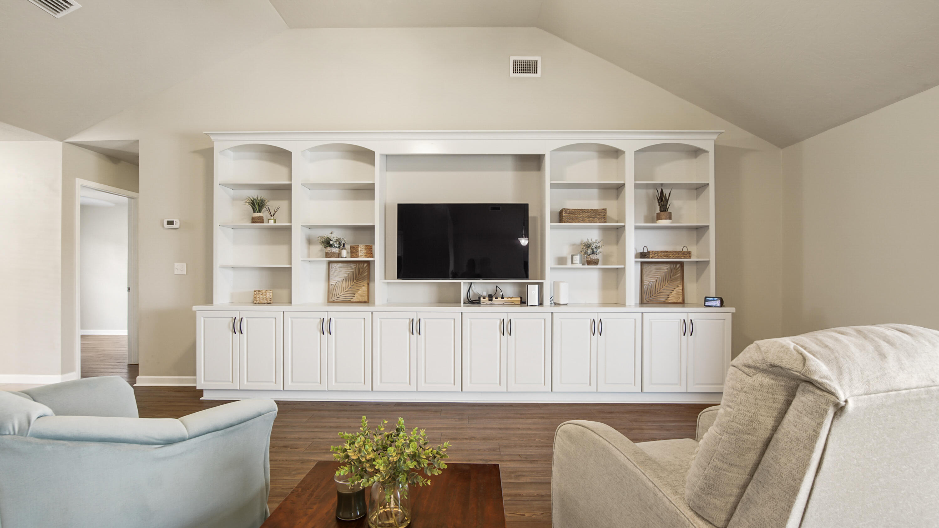 5227 Moore Loop Crestview, FL 32536 - Photo 11 of 43 a living room with furniture a flat screen tv and a potted plant