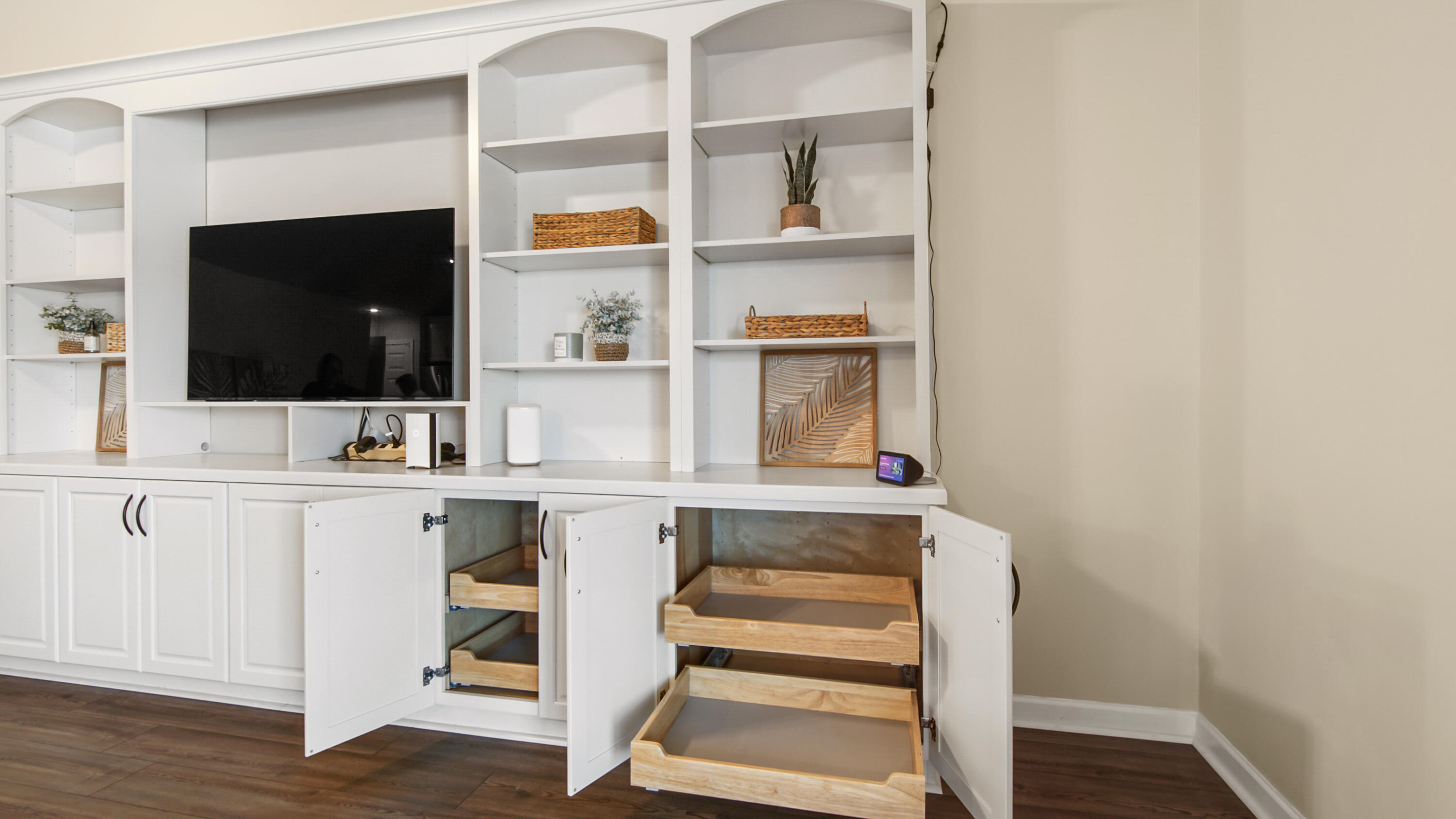 5227 Moore Loop Crestview, FL 32536 - Photo 17 of 43 a view of cabinets a flat screen tv and a table in a room
