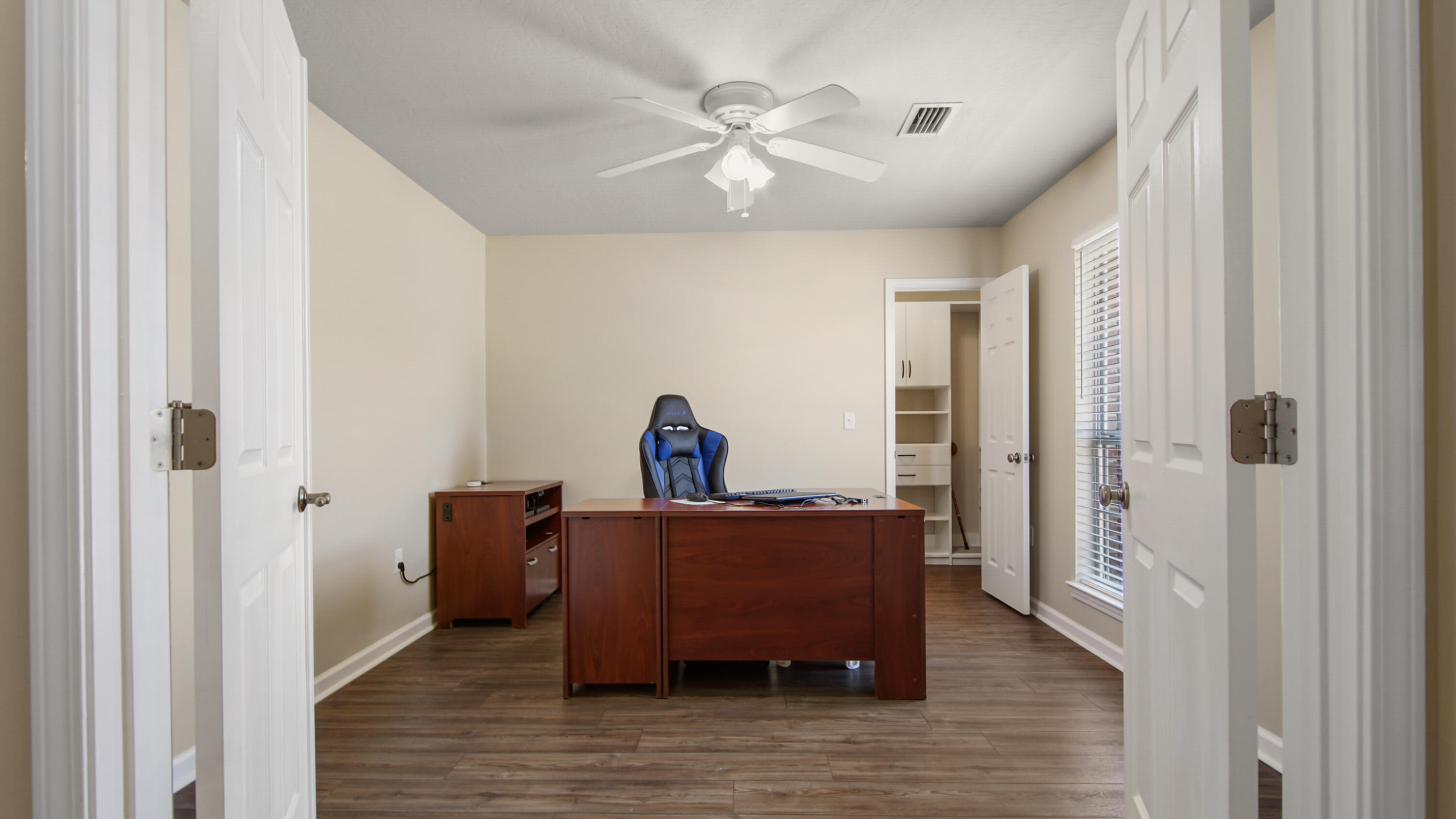 5227 Moore Loop Crestview, FL 32536 - Photo 20 of 43 a view of a workspace with furniture and a chandelier fan