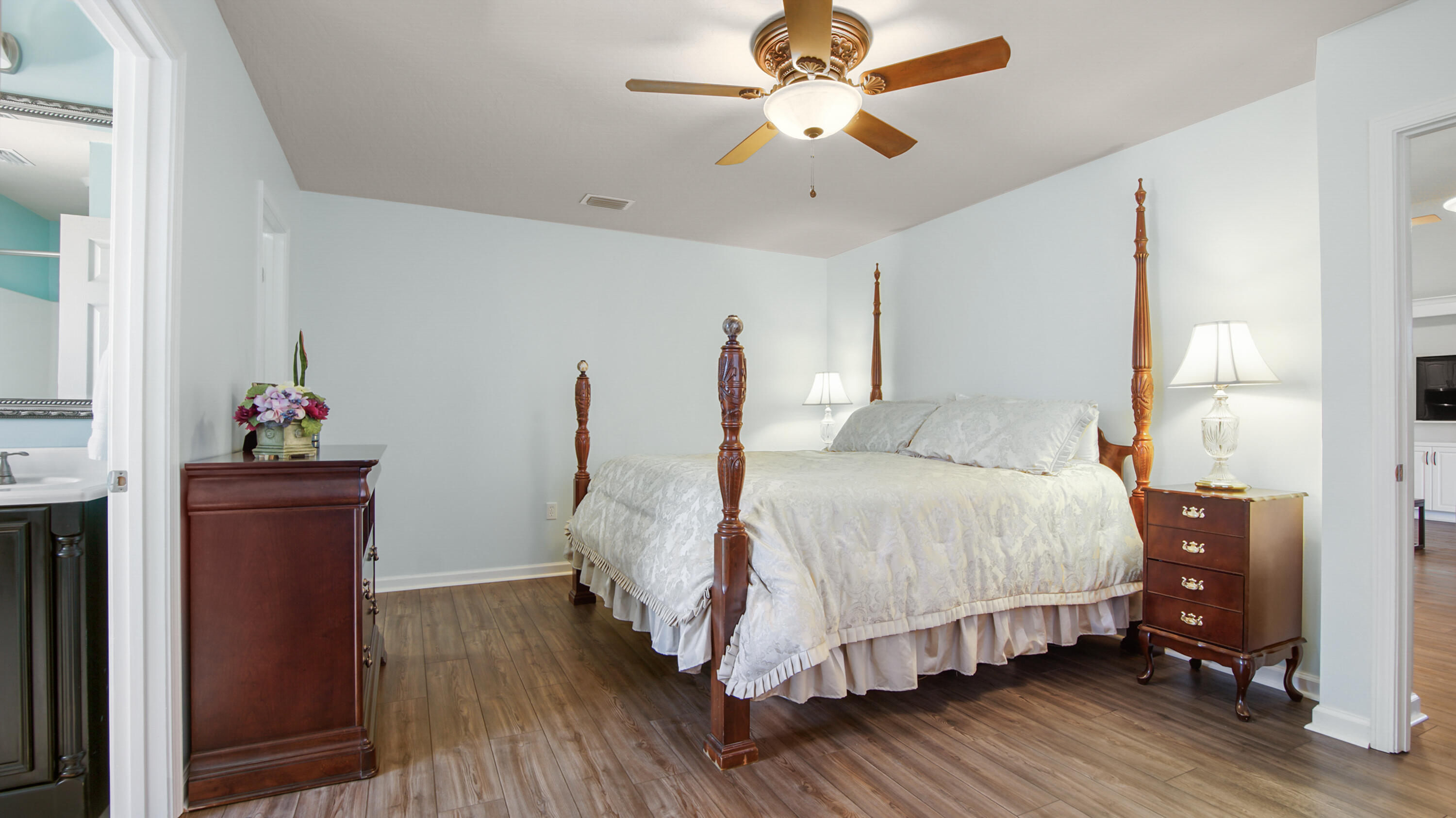 5227 Moore Loop Crestview, FL 32536 - Photo 22 of 43 a bedroom with a bed chandelier and a window