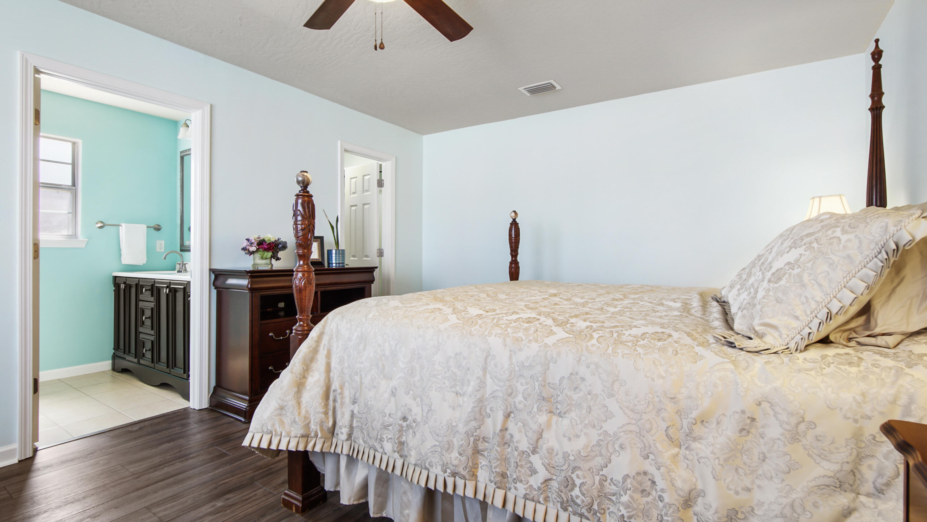 5227 Moore Loop Crestview, FL 32536 - Photo 23 of 43 a bed room with a bed and a chandelier