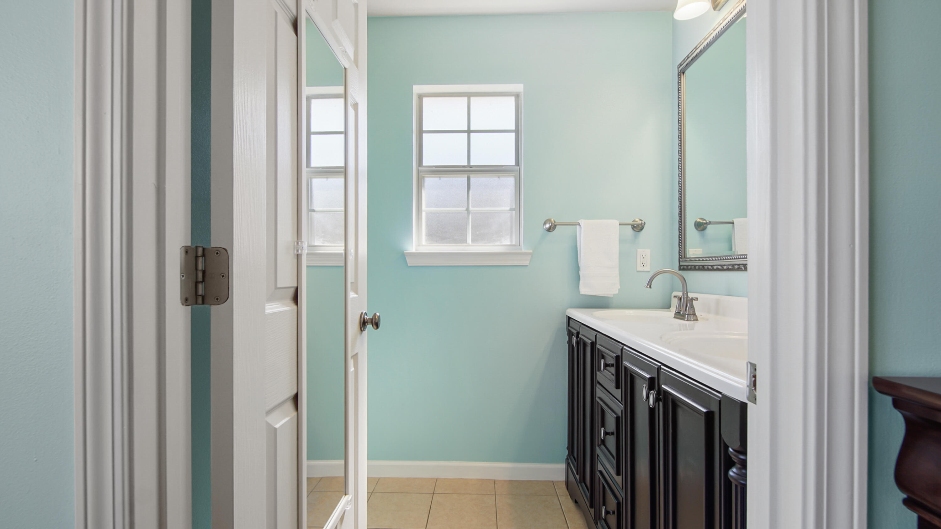 5227 Moore Loop Crestview, FL 32536 - Photo 25 of 43 a bathroom with a sink and a mirror