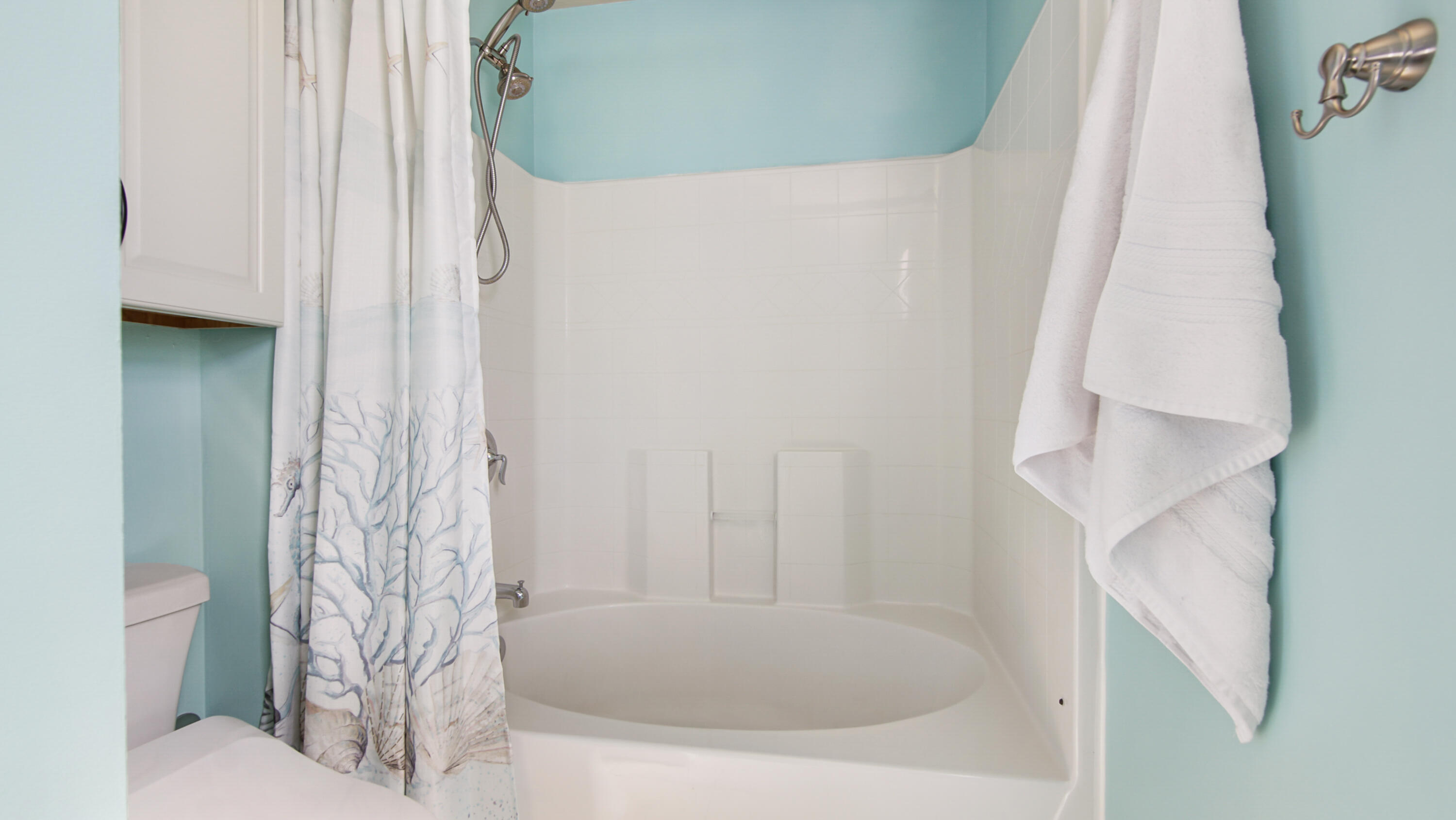 5227 Moore Loop Crestview, FL 32536 - Photo 26 of 43 a bathroom with a shower curtain and a sink