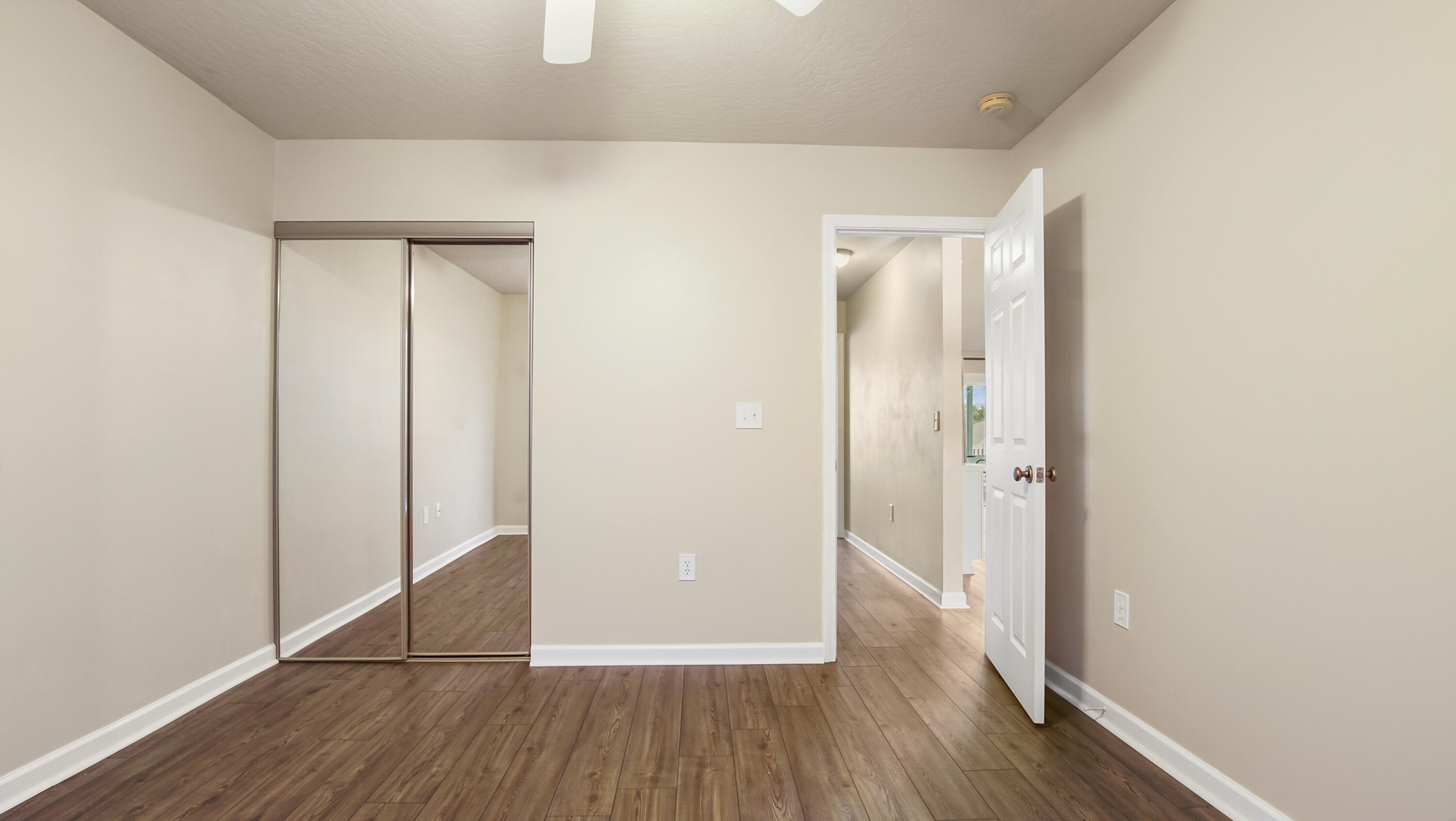 5227 Moore Loop Crestview, FL 32536 - Photo 28 of 43 a view of a hallway with wooden floor