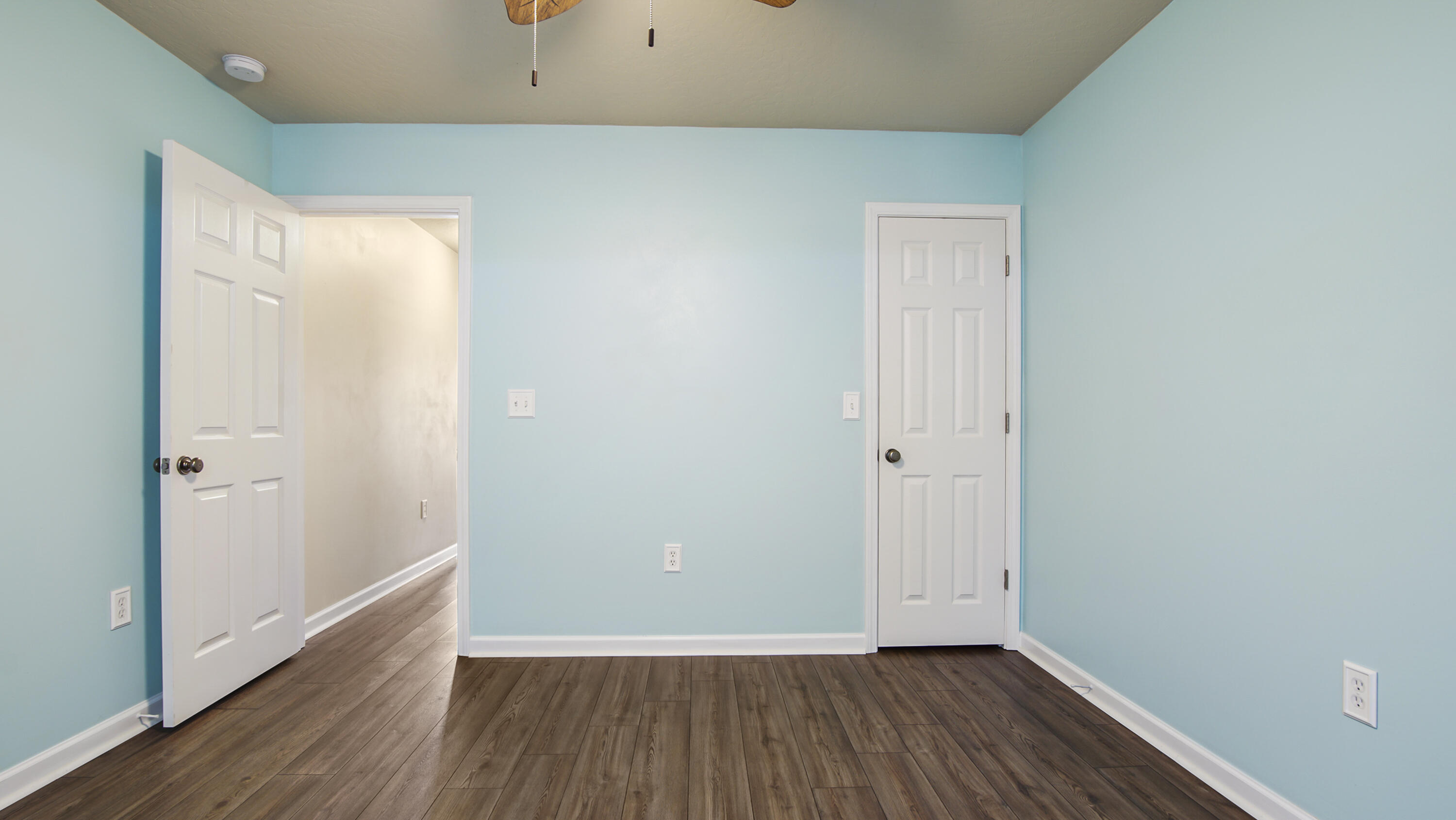 5227 Moore Loop Crestview, FL 32536 - Photo 29 of 43 a view of a room with wooden floor