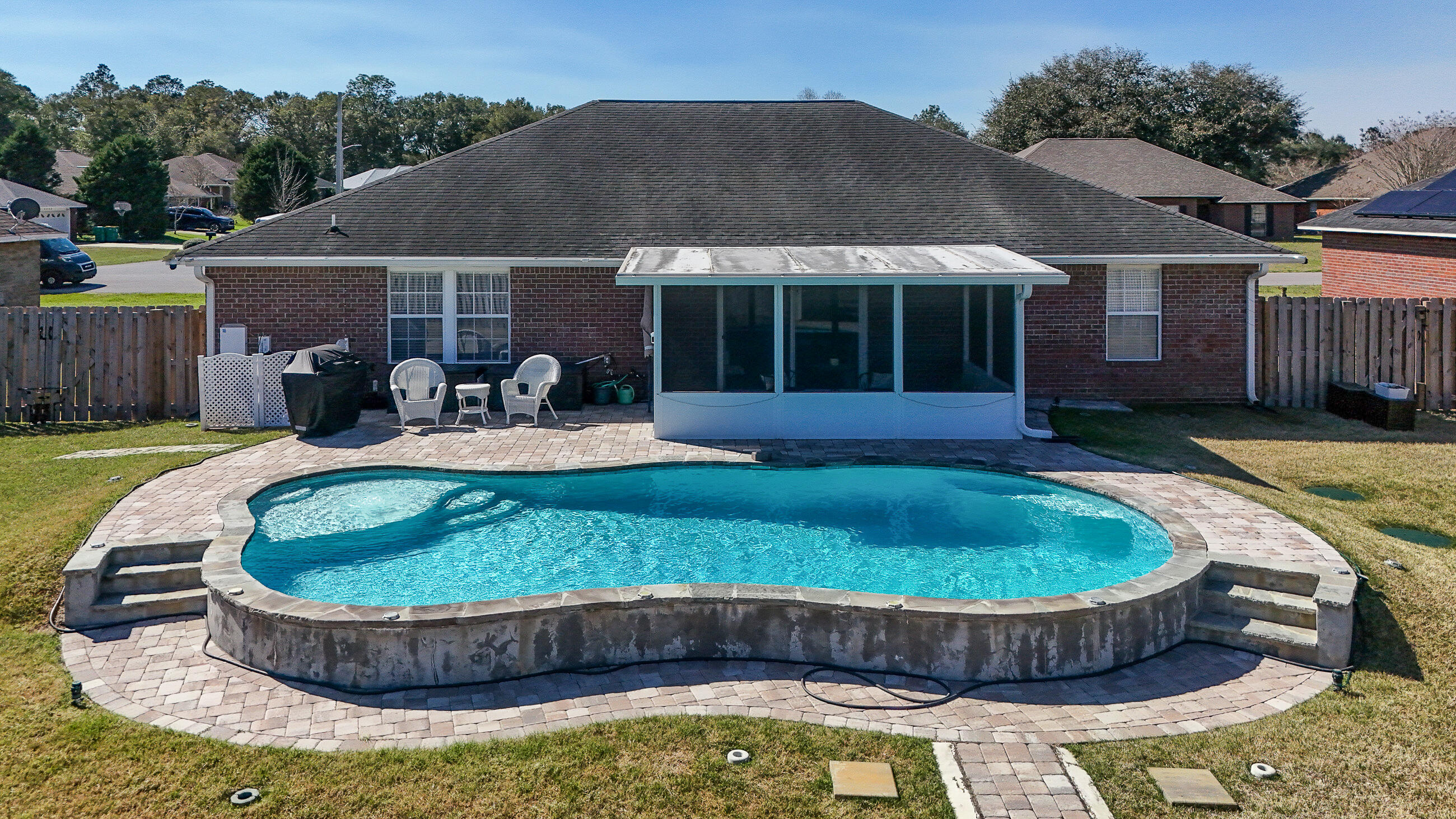 5227 Moore Loop Crestview, FL 32536 - Photo 33 of 43 a view of a house with swimming pool and porch