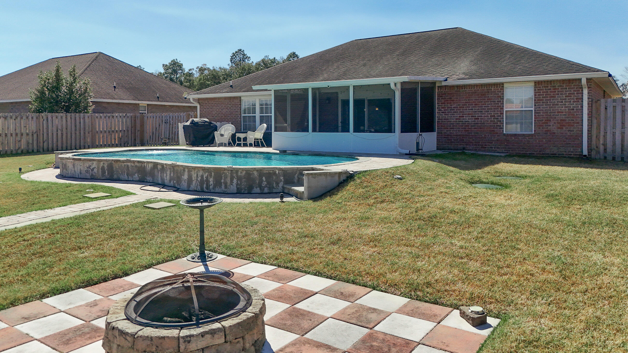5227 Moore Loop Crestview, FL 32536 - Photo 35 of 43 a front view of a house with a yard