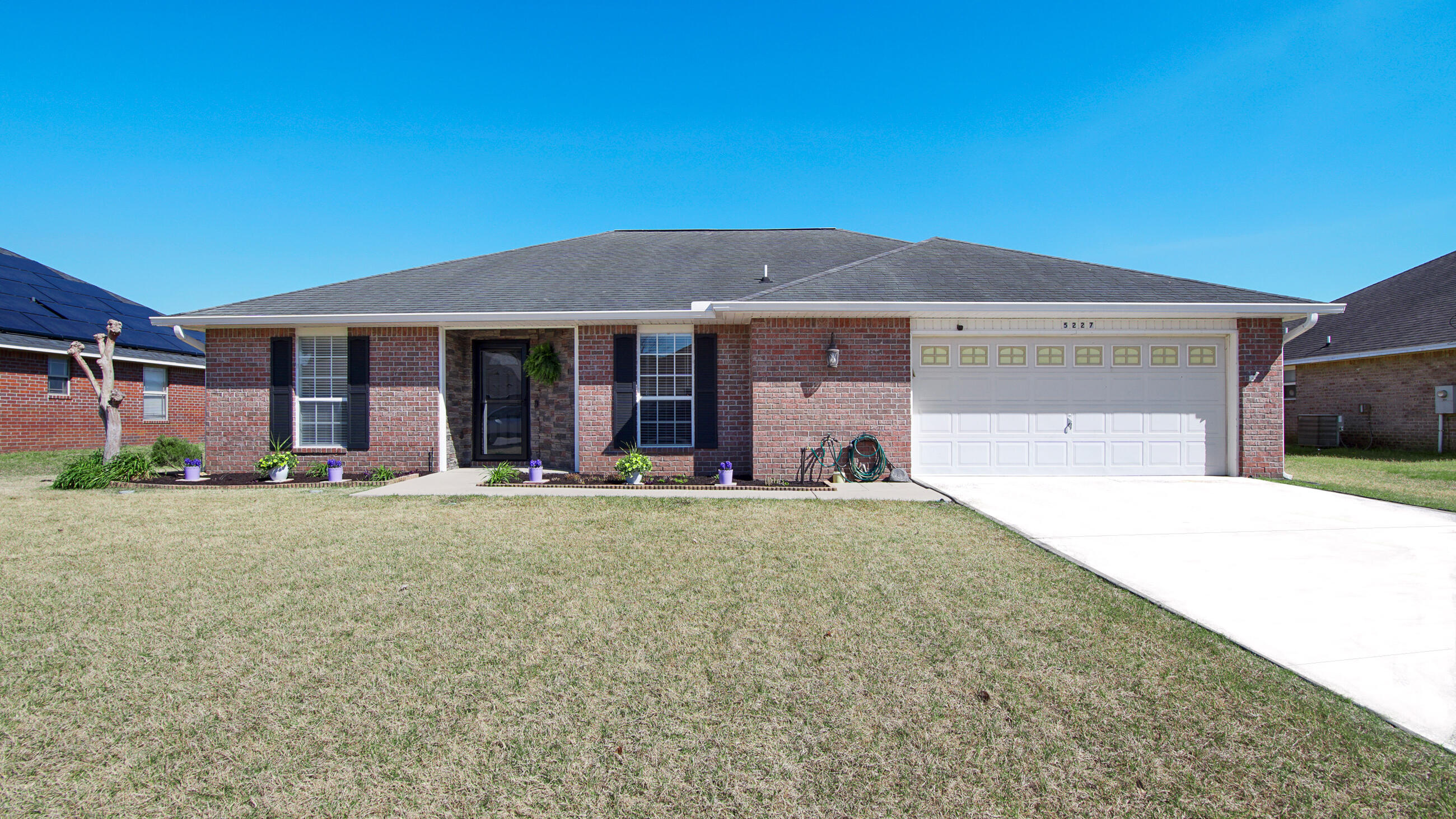 5227 Moore Loop Crestview, FL 32536 - Photo 4 of 43 a view of a house with backyard and porch