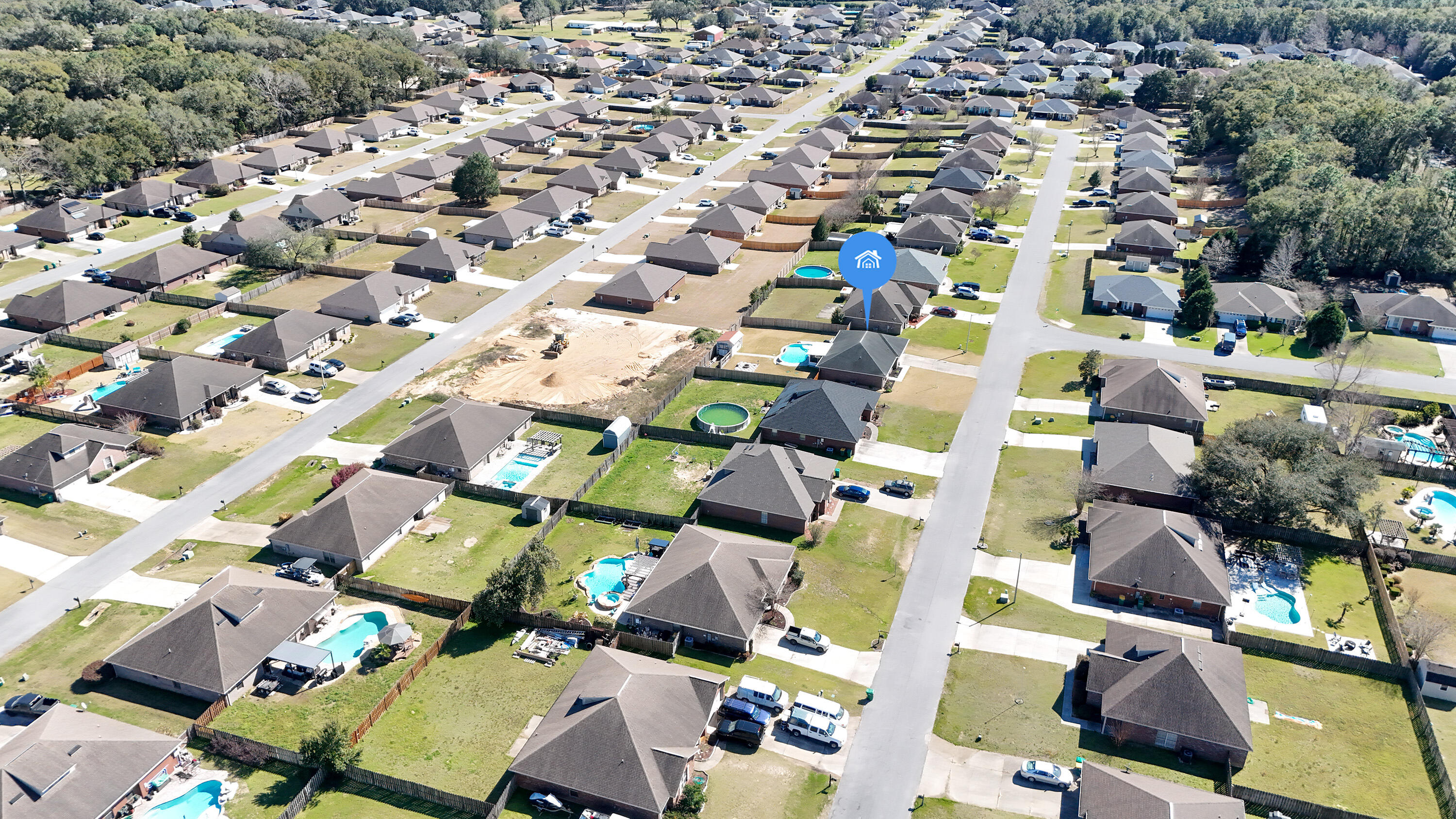 5227 Moore Loop Crestview, FL 32536 - Photo 41 of 43 an aerial view of a building with parking