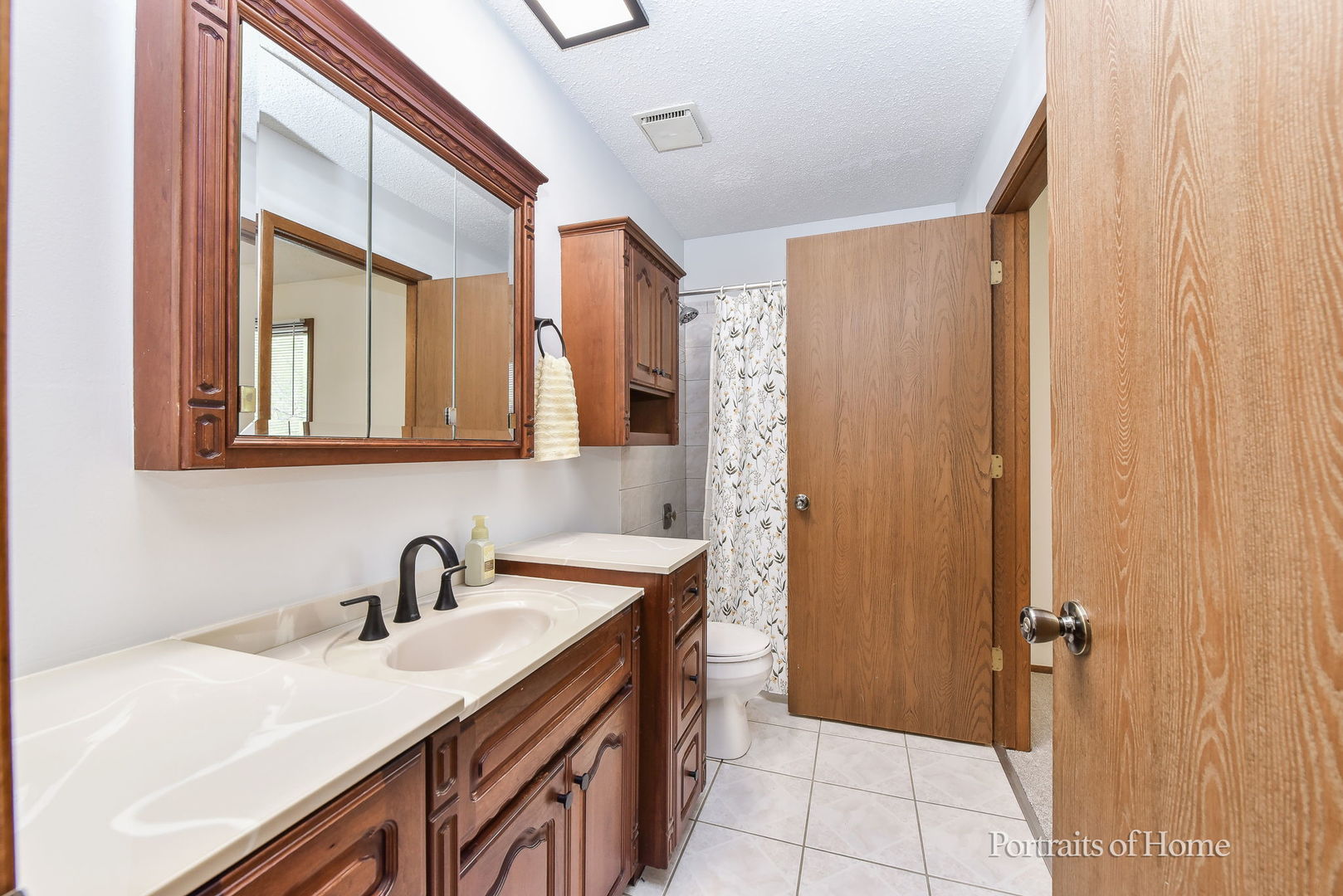 1920 Howe Lane Hanover Park, IL 60133 - Photo 17 of 25 a bathroom with a sink and a mirror