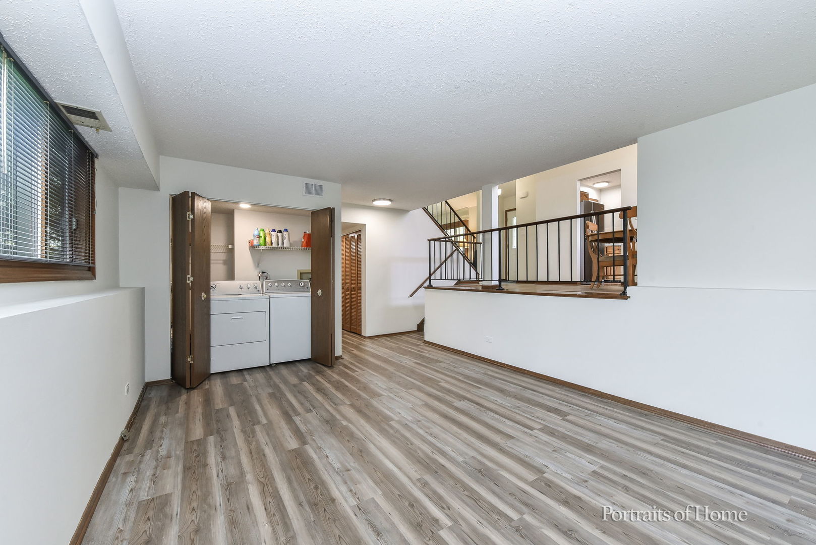 1920 Howe Lane Hanover Park, IL 60133 - Photo 21 of 25 a view of a livingroom with wooden floor and stairs