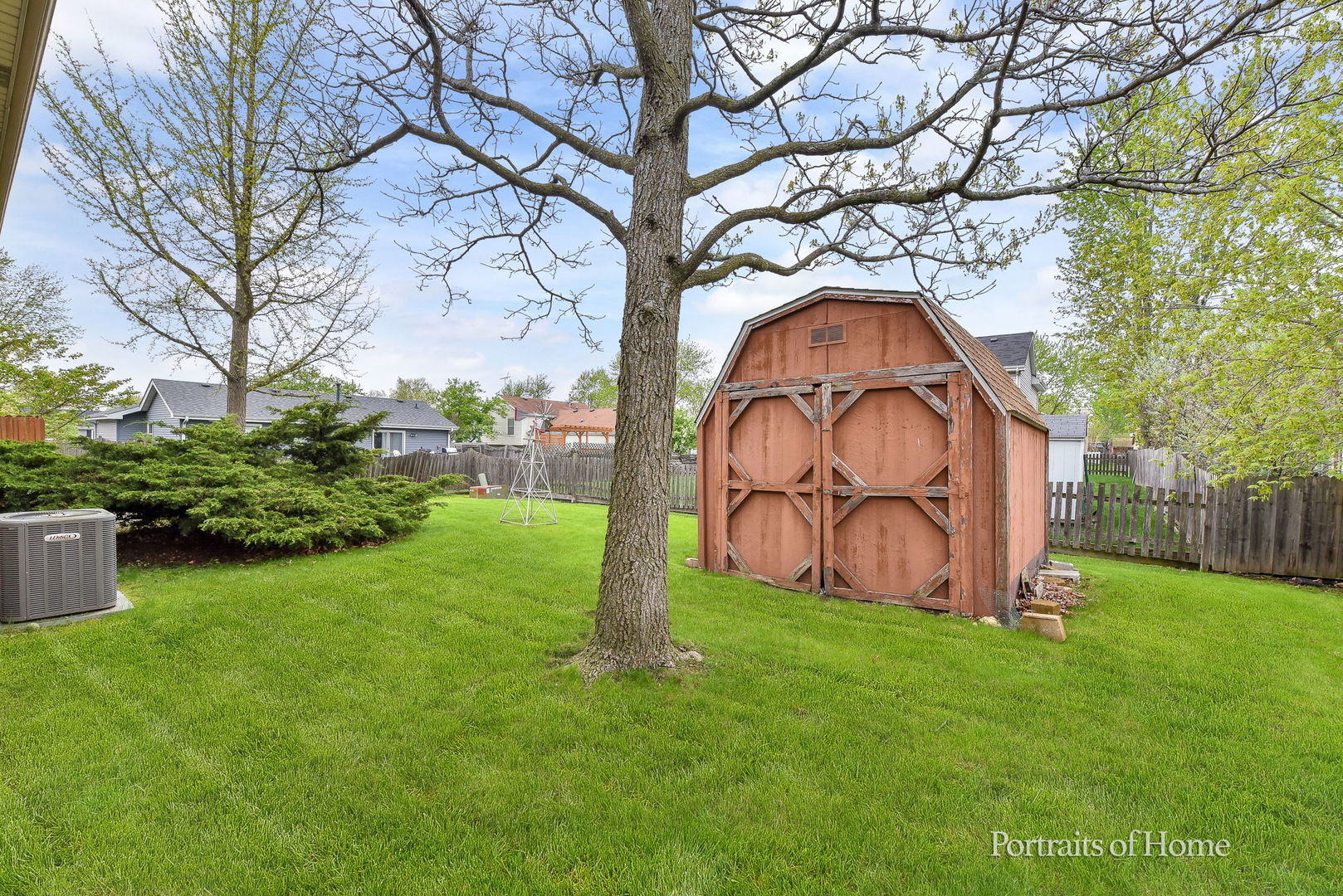 1920 Howe Lane Hanover Park, IL 60133 - Photo 25 of 25 a garden with a tree in the grass