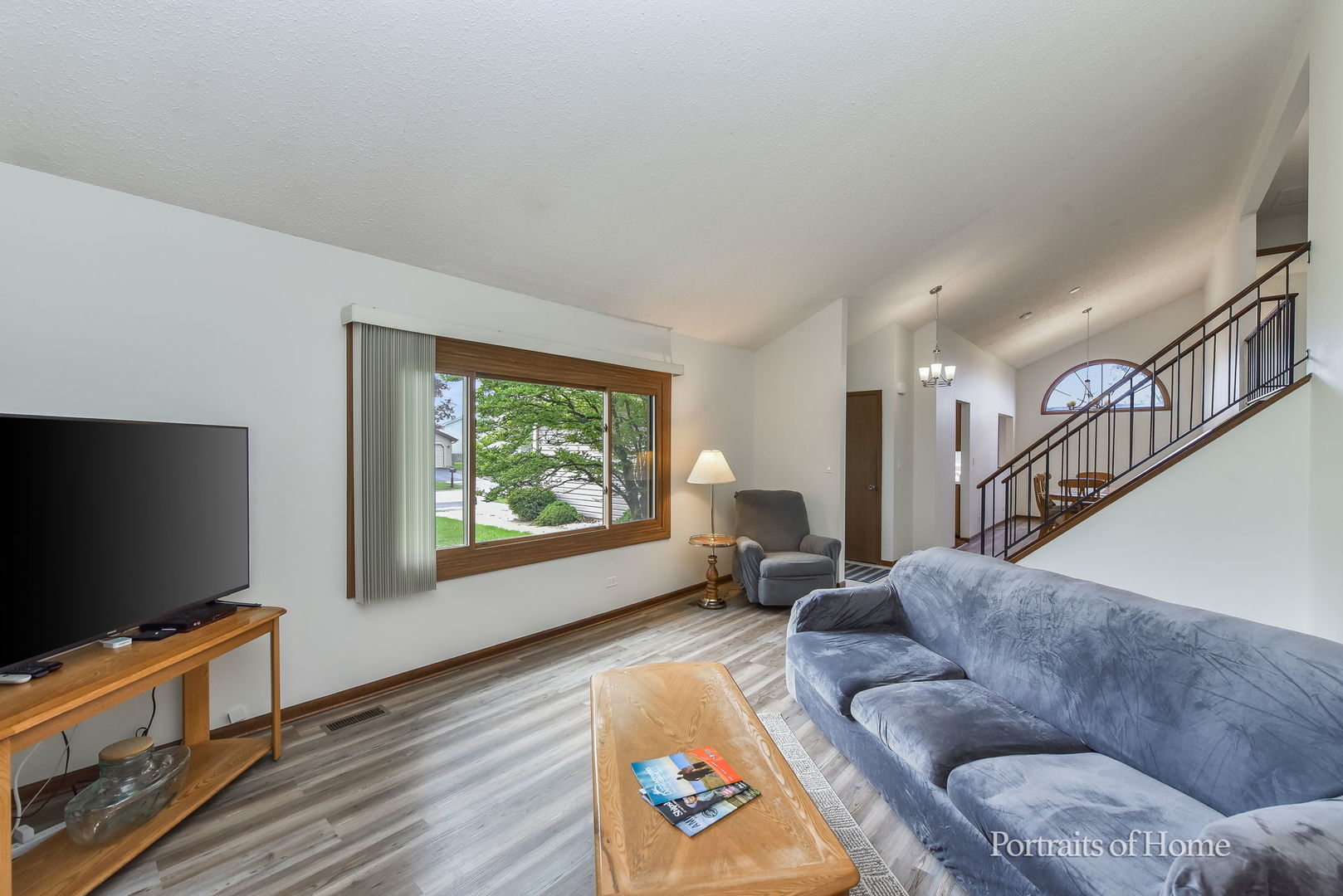1920 Howe Lane Hanover Park, IL 60133 - Photo 4 of 25 a living room with furniture and a flat screen tv