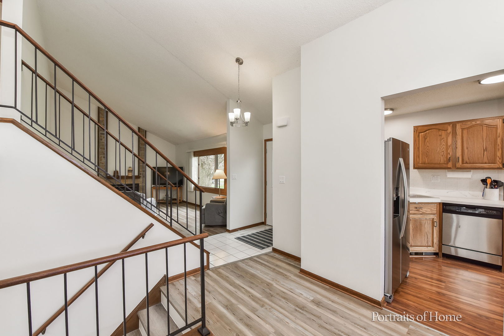 1920 Howe Lane Hanover Park, IL 60133 - Photo 5 of 25 a view of entryway and kitchen with wooden floor