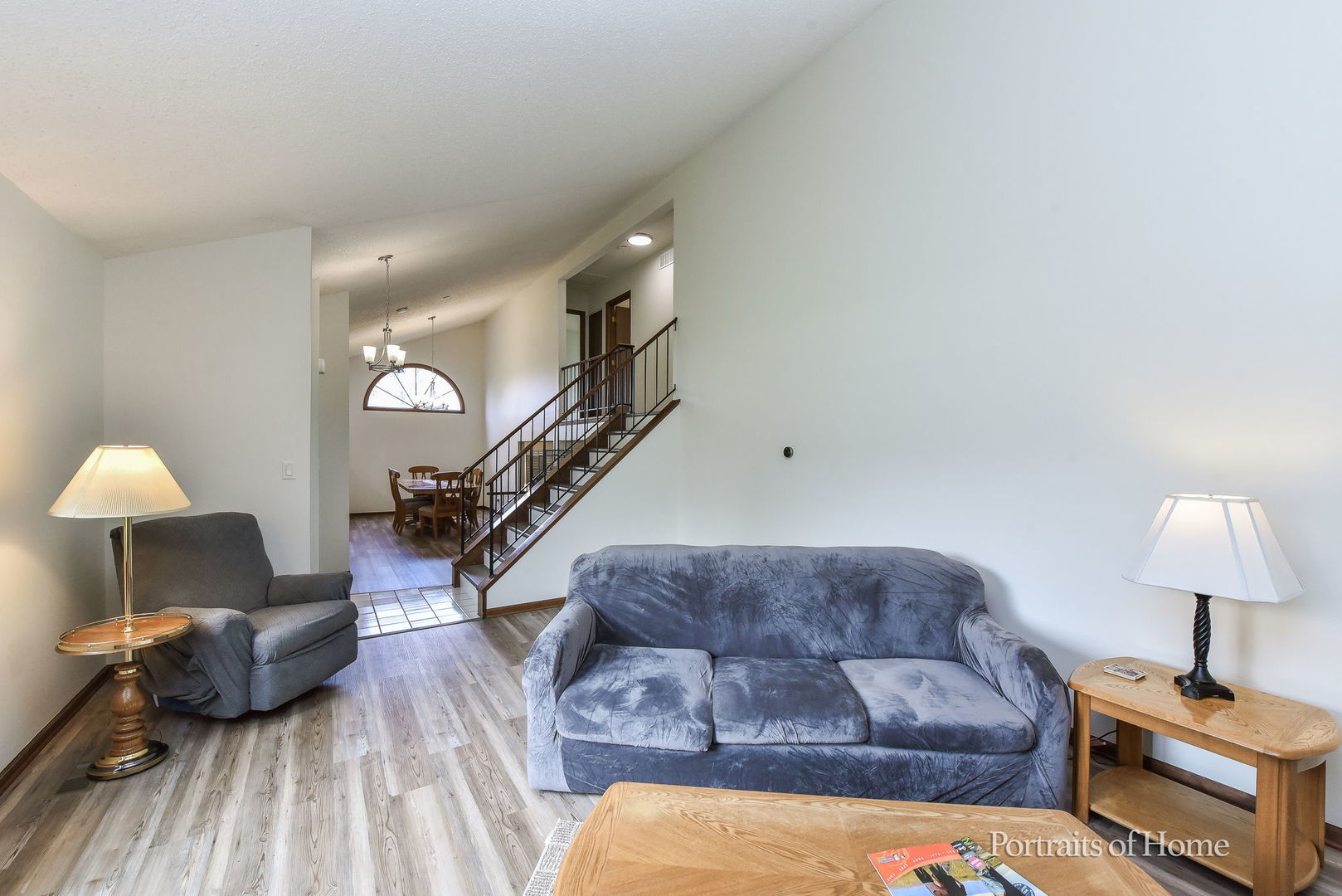 1920 Howe Lane Hanover Park, IL 60133 - Photo 7 of 25 a living room with furniture and a lamp