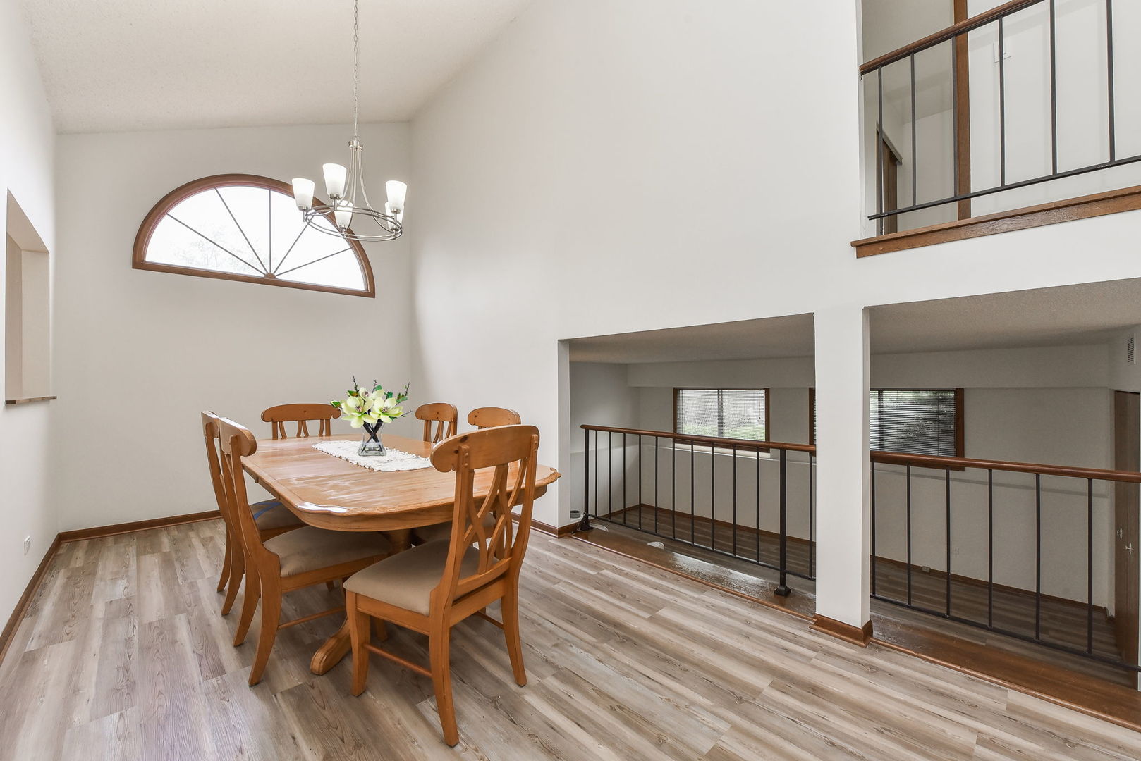 1920 Howe Lane Hanover Park, IL 60133 - Photo 8 of 25 a dining room with furniture a chandelier and wooden floor