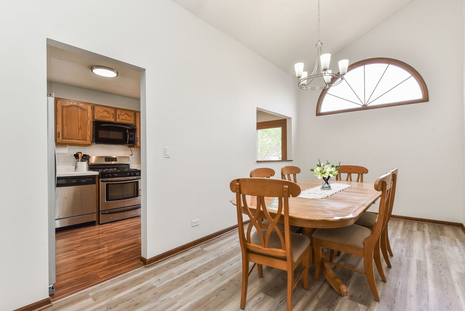 1920 Howe Lane Hanover Park, IL 60133 - Photo 10 of 25 a view of a dining room with furniture and wooden floor
