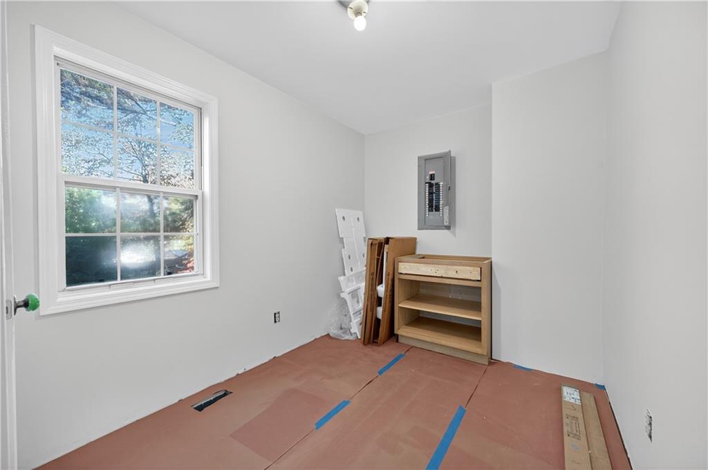 4460 Suwanee Dam Road Suwanee, GA 30024 - Photo 18 of 38 a bedroom with a bed and a window