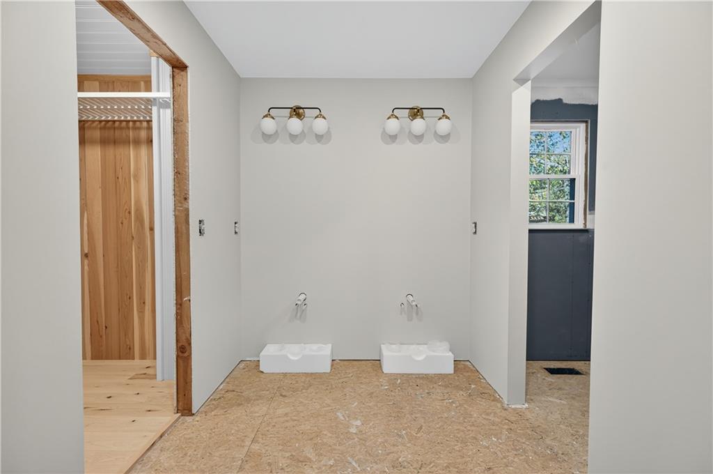 4460 Suwanee Dam Road Suwanee, GA 30024 - Photo 23 of 38 an empty room with wall painting and a window