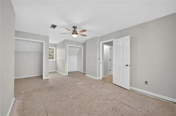 a view of empty room with fan