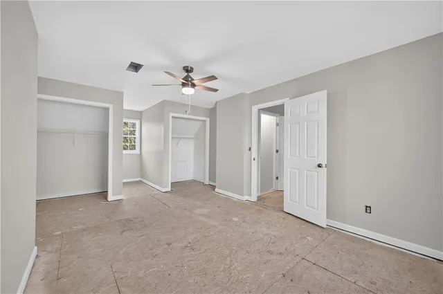 a view of empty room with fan