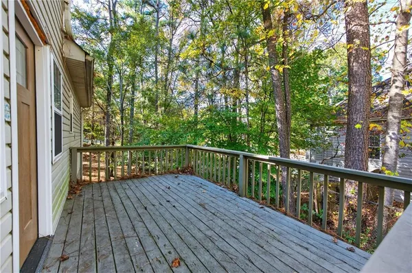 a view of balcony with wooden floor