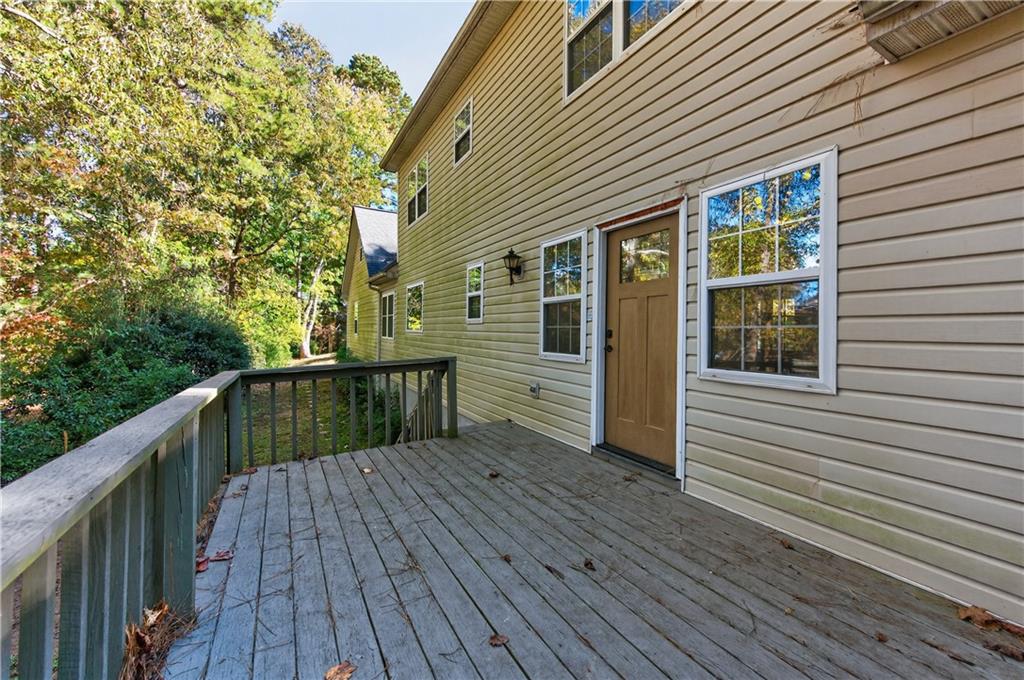 4460 Suwanee Dam Road Suwanee, GA 30024 - Photo 31 of 38 a view of a house with a deck