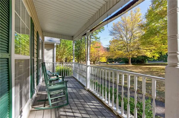 a view of balcony with furniture