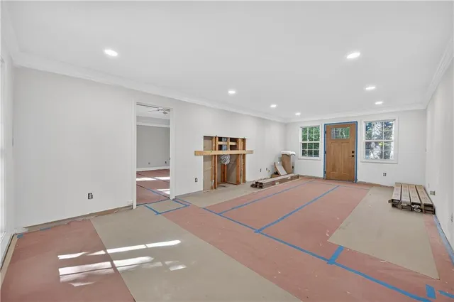 a room with a bed and a chandelier