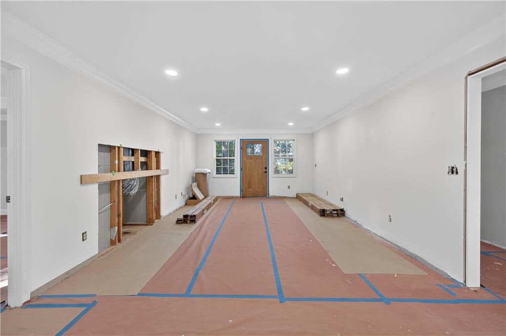 4460 Suwanee Dam Road Suwanee, GA 30024 - Photo 9 of 38 a view of a living room hardwood floor