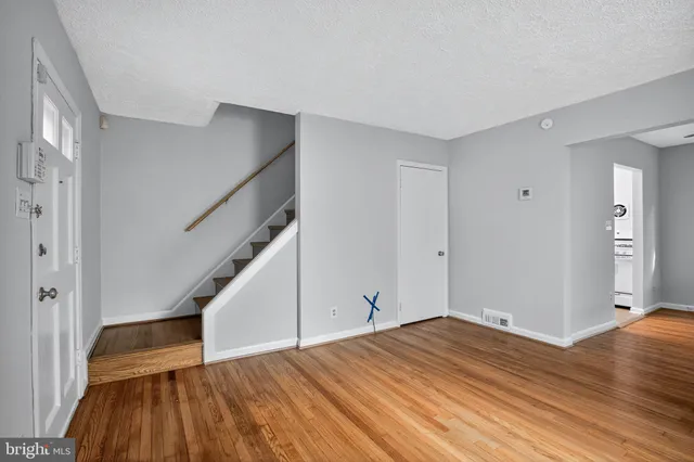 a view of a hallway with washer and dryer