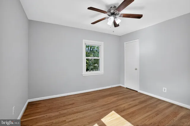 a view of workspace with wooden floor and window