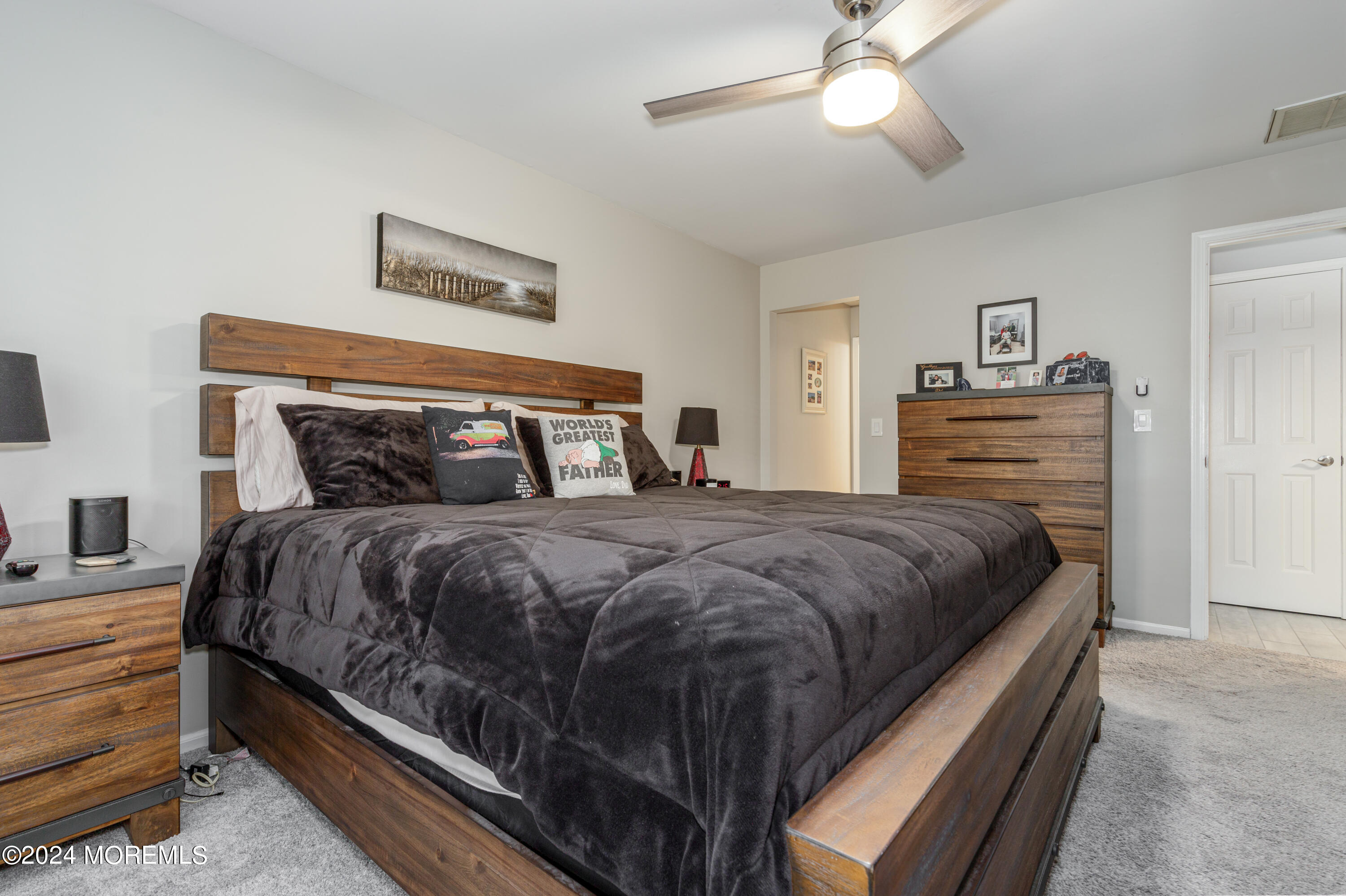 10 Cherrywood Circle Brick, NJ 08724 - Photo 14 of 27 a bedroom with a bed and a chandelier