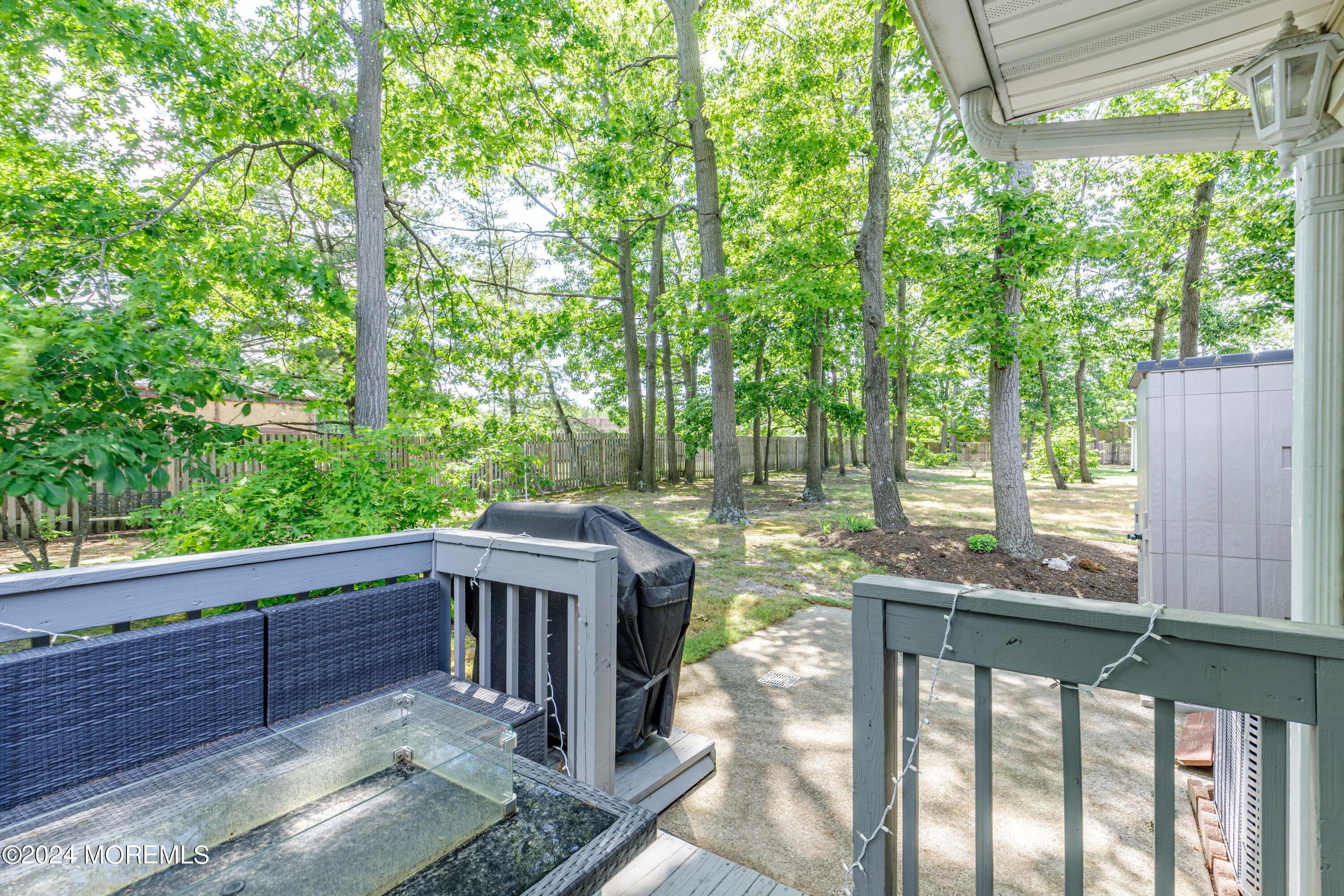 10 Cherrywood Circle Brick, NJ 08724 - Photo 19 of 27 a view of backyard with green space and deck