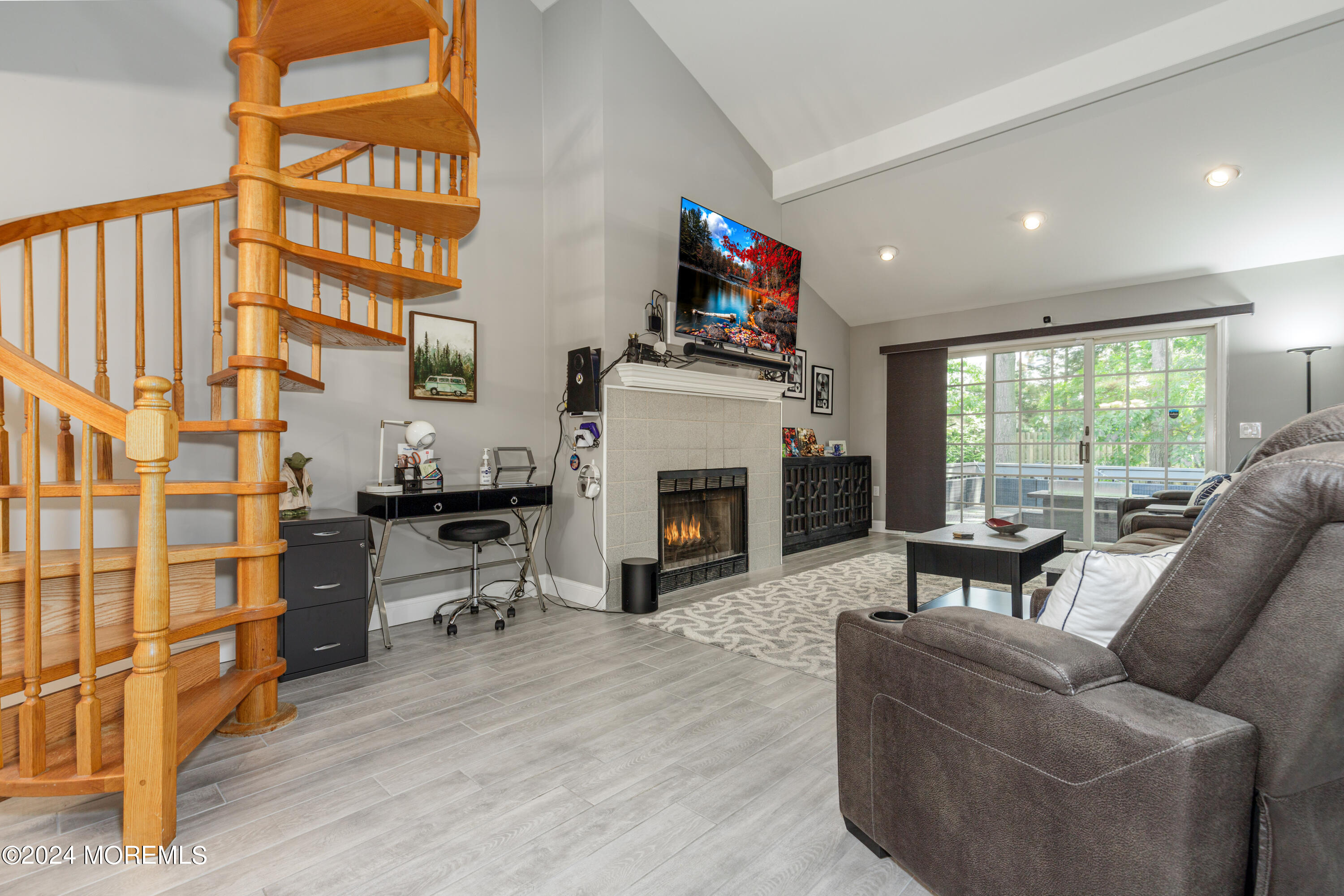 10 Cherrywood Circle Brick, NJ 08724 - Photo 4 of 27 a living room with furniture a fireplace and a flat screen tv