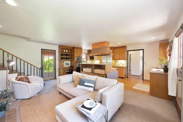 a kitchen with stainless steel appliances granite countertop a sink and a stove