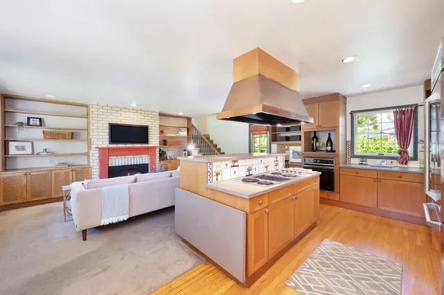 a kitchen with a stove a sink and a refrigerator