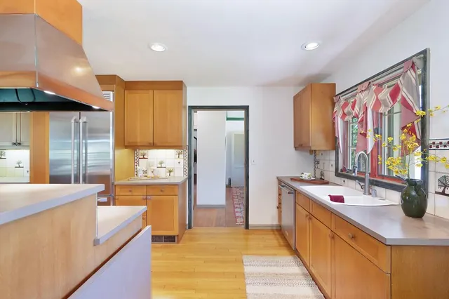 a view of a room that has a table and chairs in it